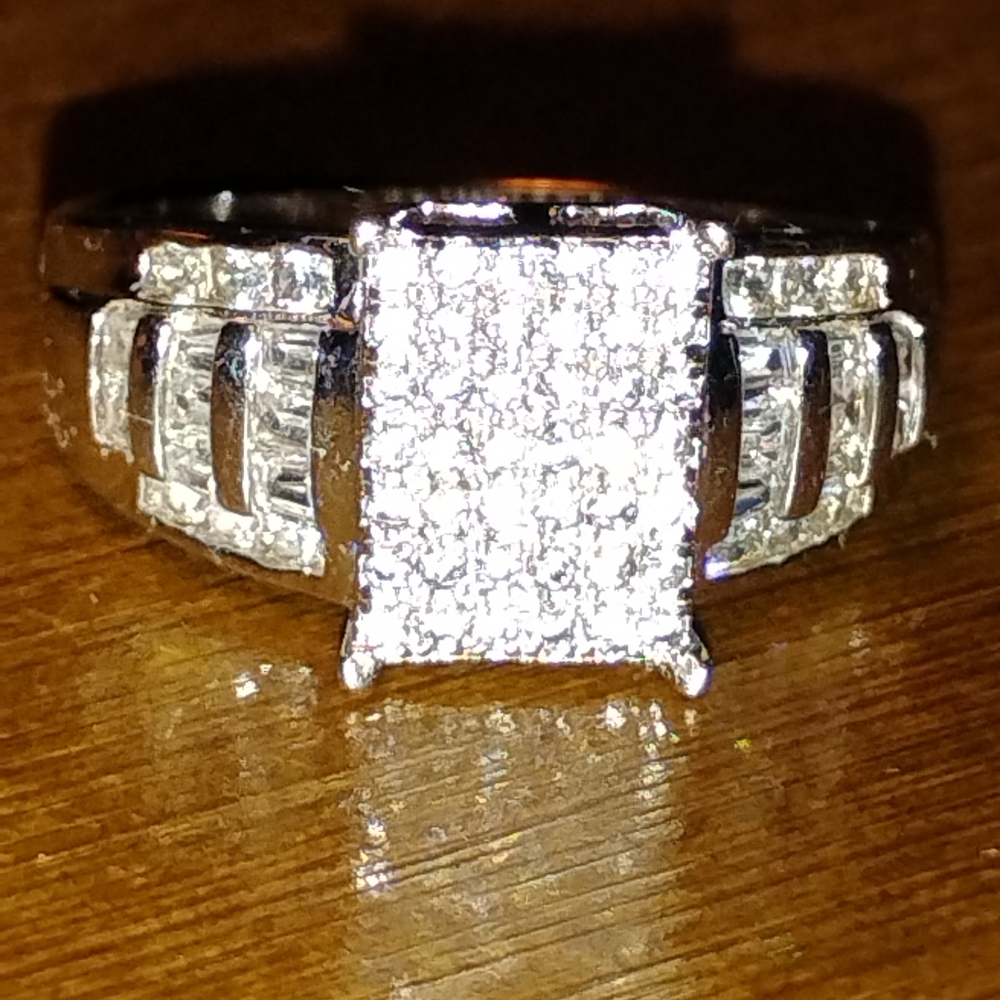 Sterling Silver engagement ring featuring invisible-set princess-cut and channel